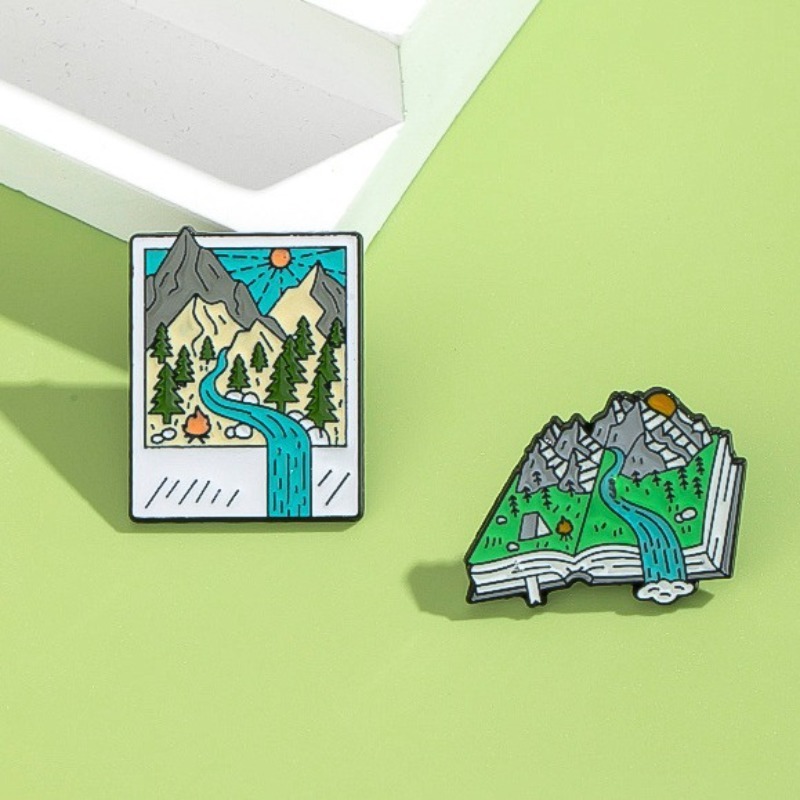 Geëmailleerde pinnen met avont - Outdoor Adventure Friends recensie en prijs